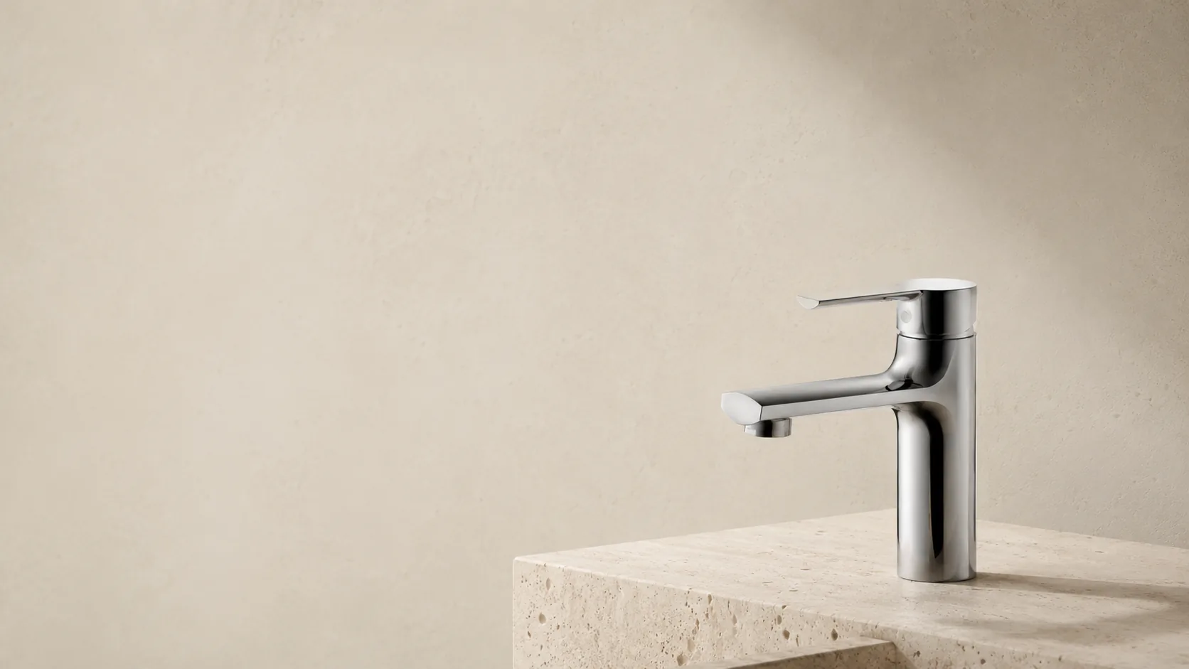 MORO basin mixer in a travertine bathroom